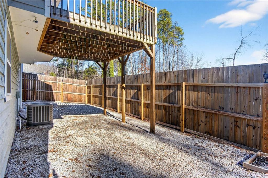 808 Emerald Chase Powder Springs, GA 30127 - Photo 27 of 32 a view of outdoor space with wooden fence