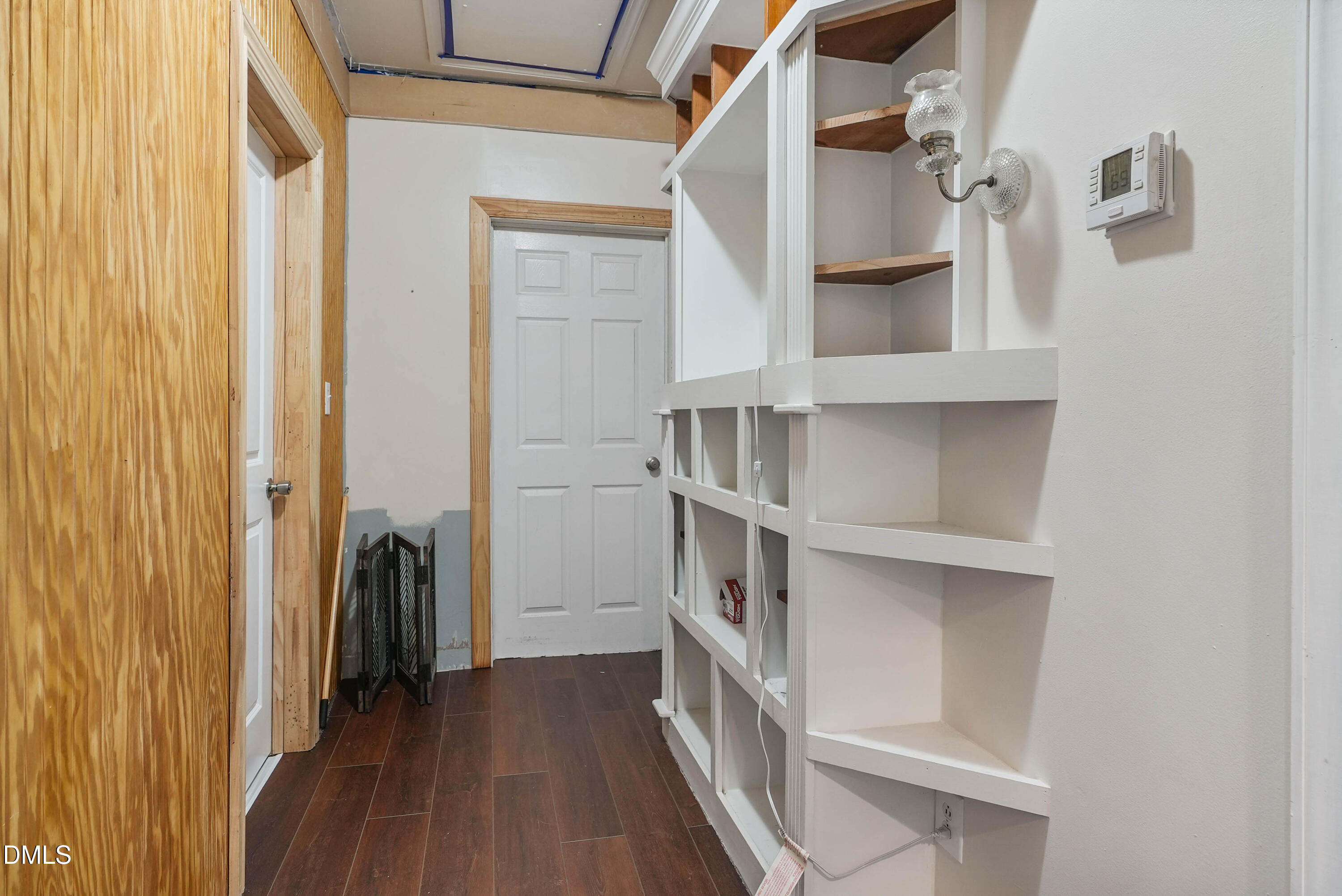 7406 Old Beulah Road Kenly, NC 27542 - Photo 14 of 30 Wood-finish flooring with white built-in shelving