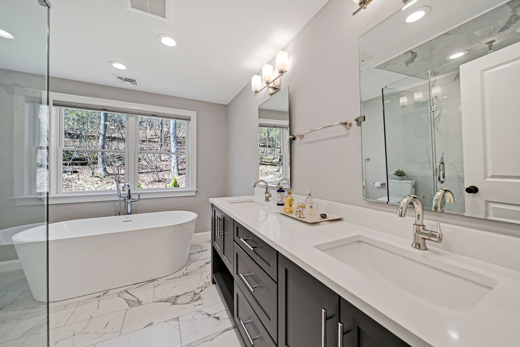 17 Sunrise Terrace Needham, MA 02492 - Photo 18 of 42 a spacious bathroom with a double vanity sink tub mirror and window