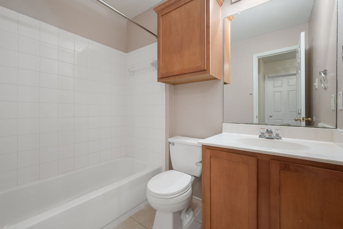 2361 Pearson Way Round Rock, TX 78665 - Photo 16 of 32 a bathroom with a sink toilet and bathtub