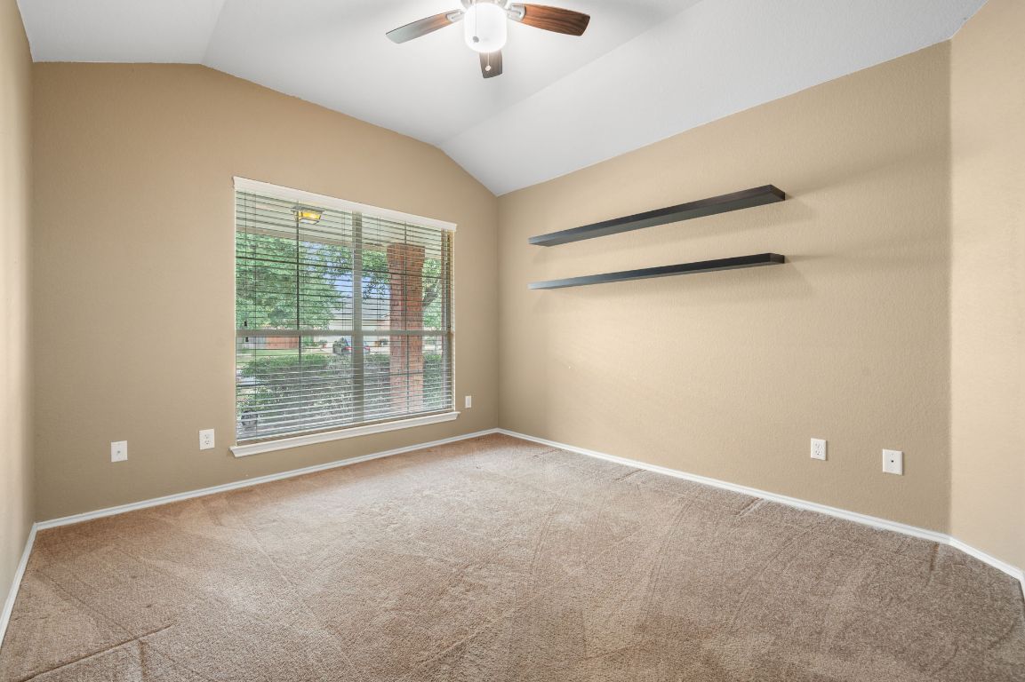 2361 Pearson Way Round Rock, TX 78665 - Photo 17 of 32 a view of an empty room with a window