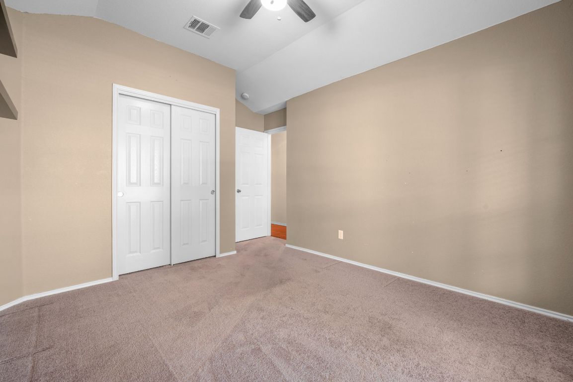 2361 Pearson Way Round Rock, TX 78665 - Photo 18 of 32 a view of an empty room and a fan