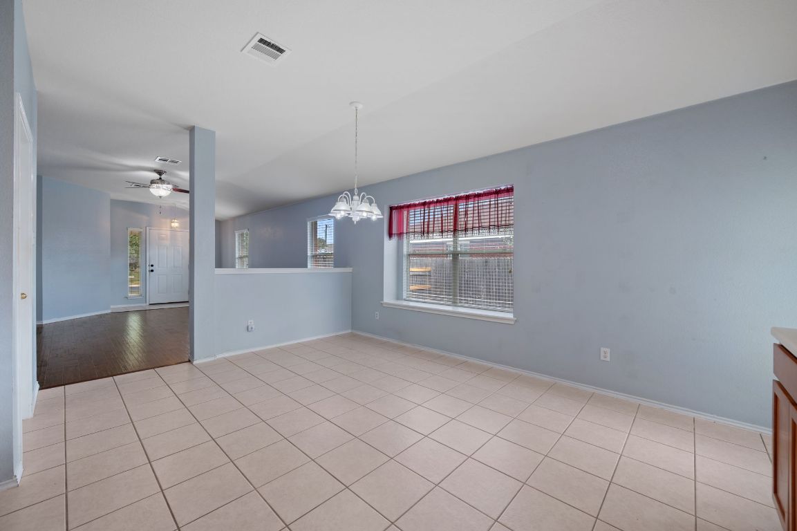 2361 Pearson Way Round Rock, TX 78665 - Photo 8 of 32 a view of an empty room with window and cabinet