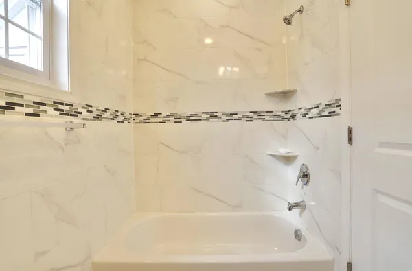 a bathroom with a shower and a shower