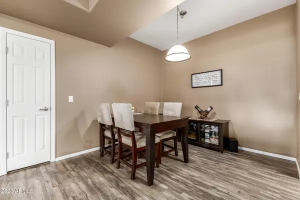 a view of a dining room with furniture and wooden floor