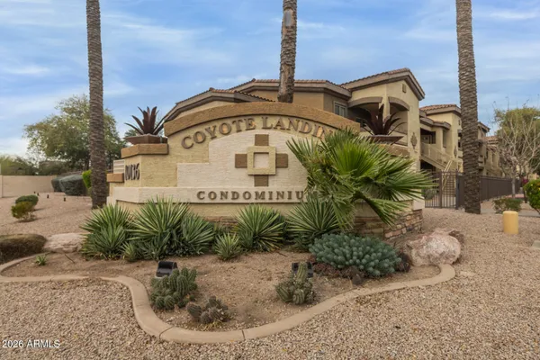 a view of a street with a building in the background