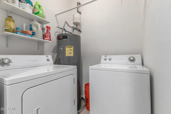 a utility room with dryer and washer