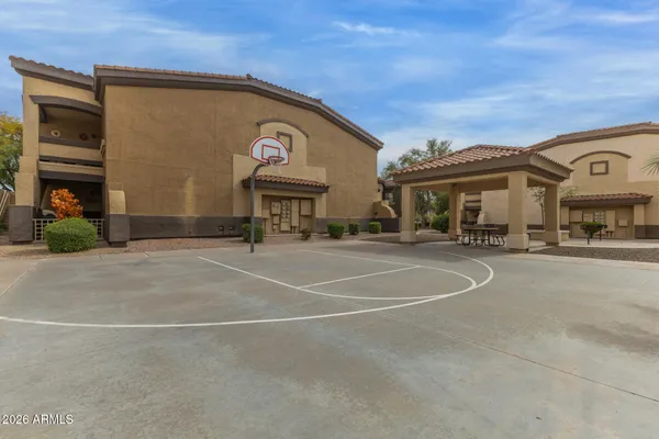 a view of a field of grass and trees