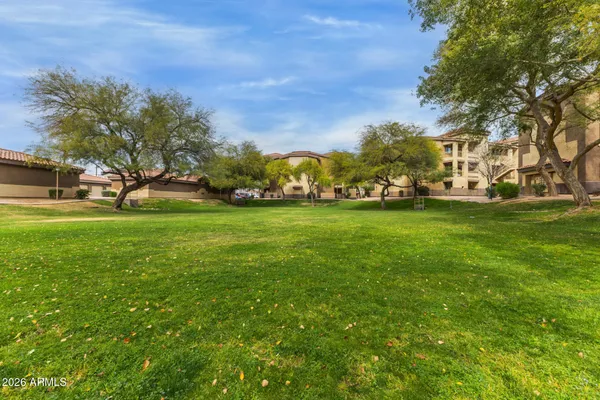 a view of a street with stores