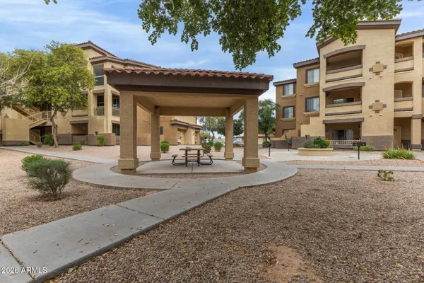 a view of a swimming pool with outdoor seating
