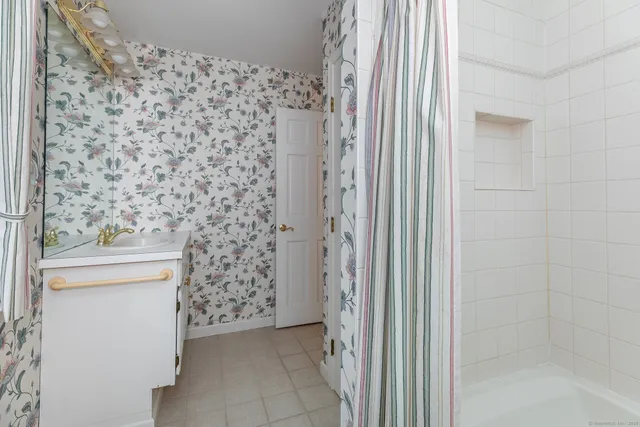 a bathroom with a shower curtain