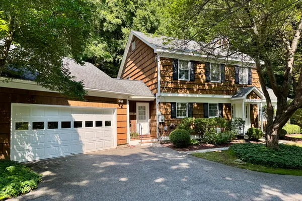 front view of a house with a garden
