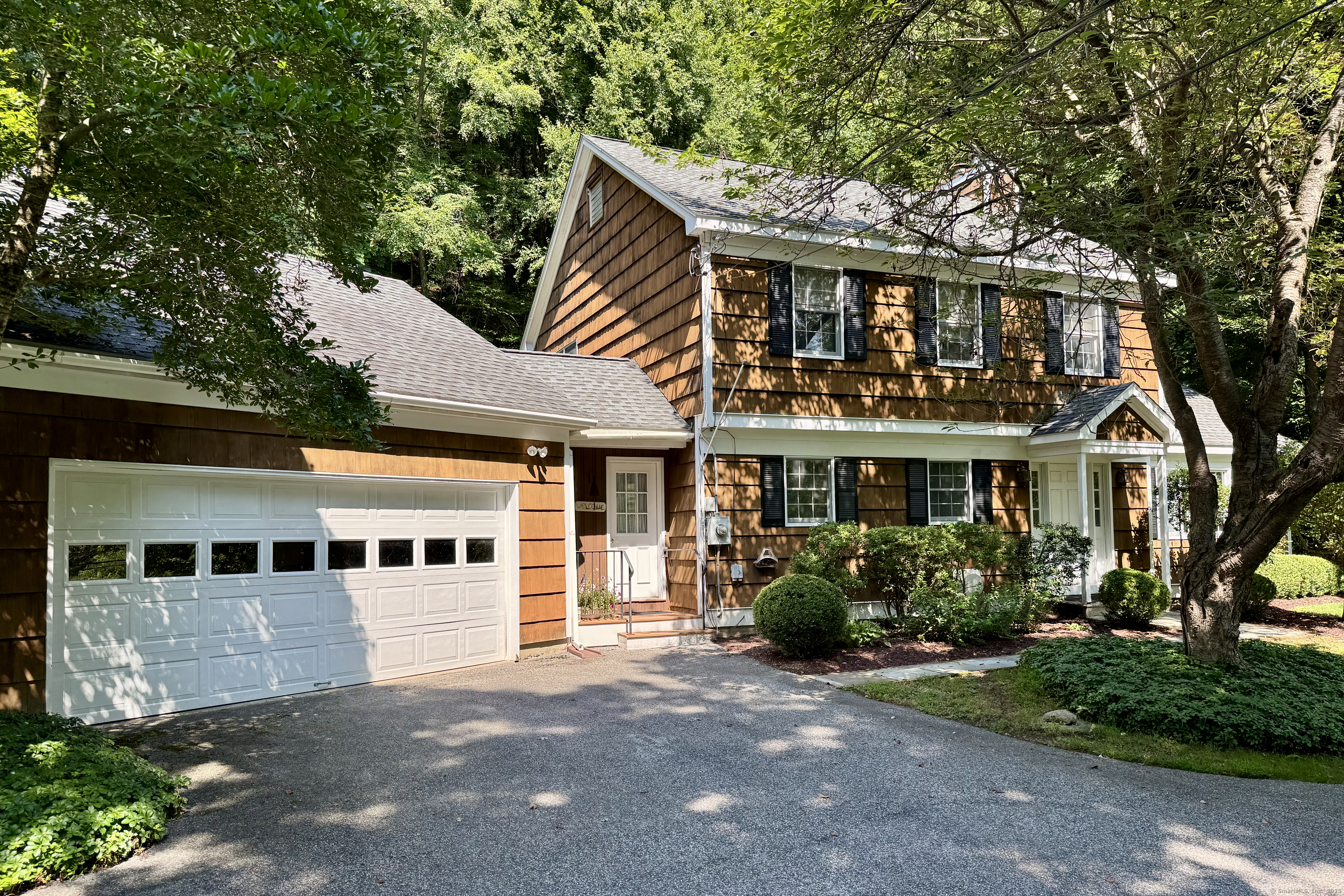 132 South Kent Road Kent, CT 06757 - Photo 3 of 26 front view of a house with a garden