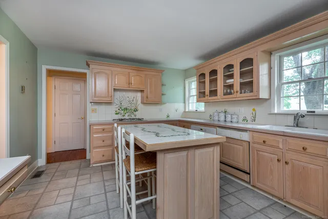 a kitchen with a stove a sink and a refrigerator
