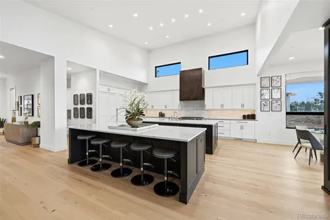 a kitchen with stainless steel appliances a sink and a refrigerator