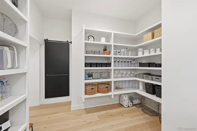 a living room with furniture pool table and a flat screen tv