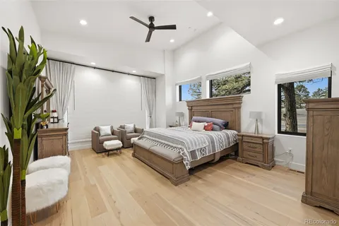 a spacious bedroom with a bed and a couch