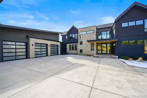 a front view of a house with a garage