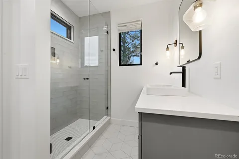 a bathroom with a sink and mirror