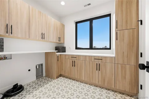 a bathroom with a sink a mirror and cabinets