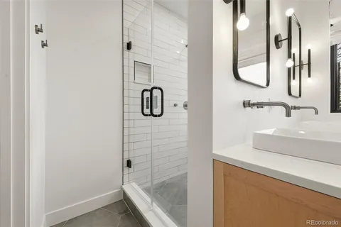 a bathroom with a sink and mirror