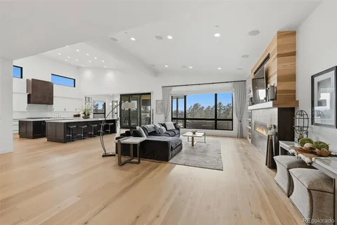 a living room with fireplace furniture and a flat screen tv
