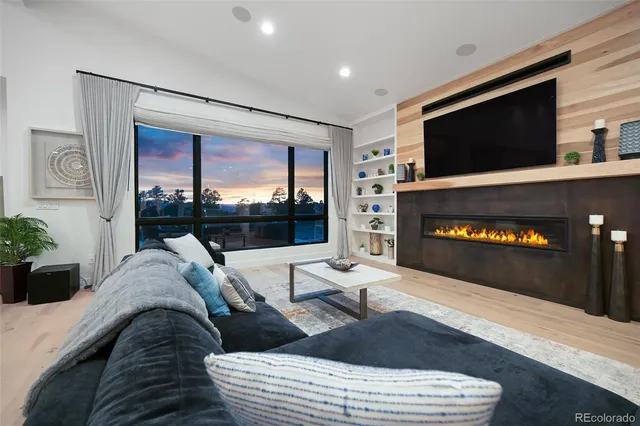 a room with walk in closet with wooden floor and a window