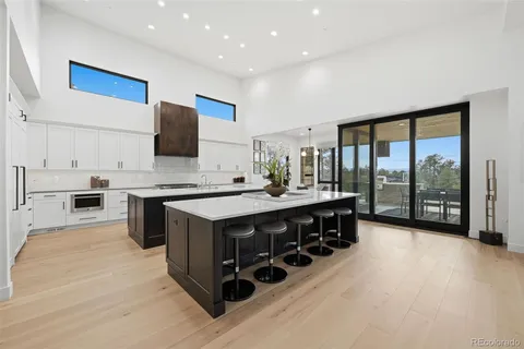 a kitchen with a stove a sink and a refrigerator