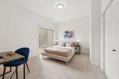 a room with a bed and a chair