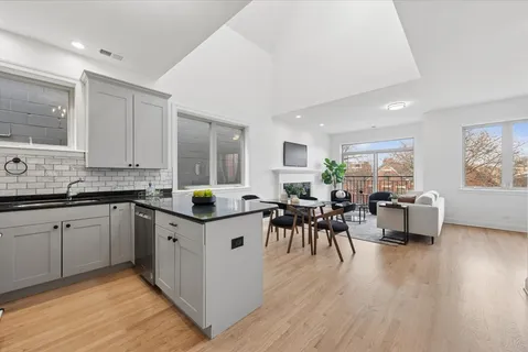 a kitchen with granite countertop a sink and appliances