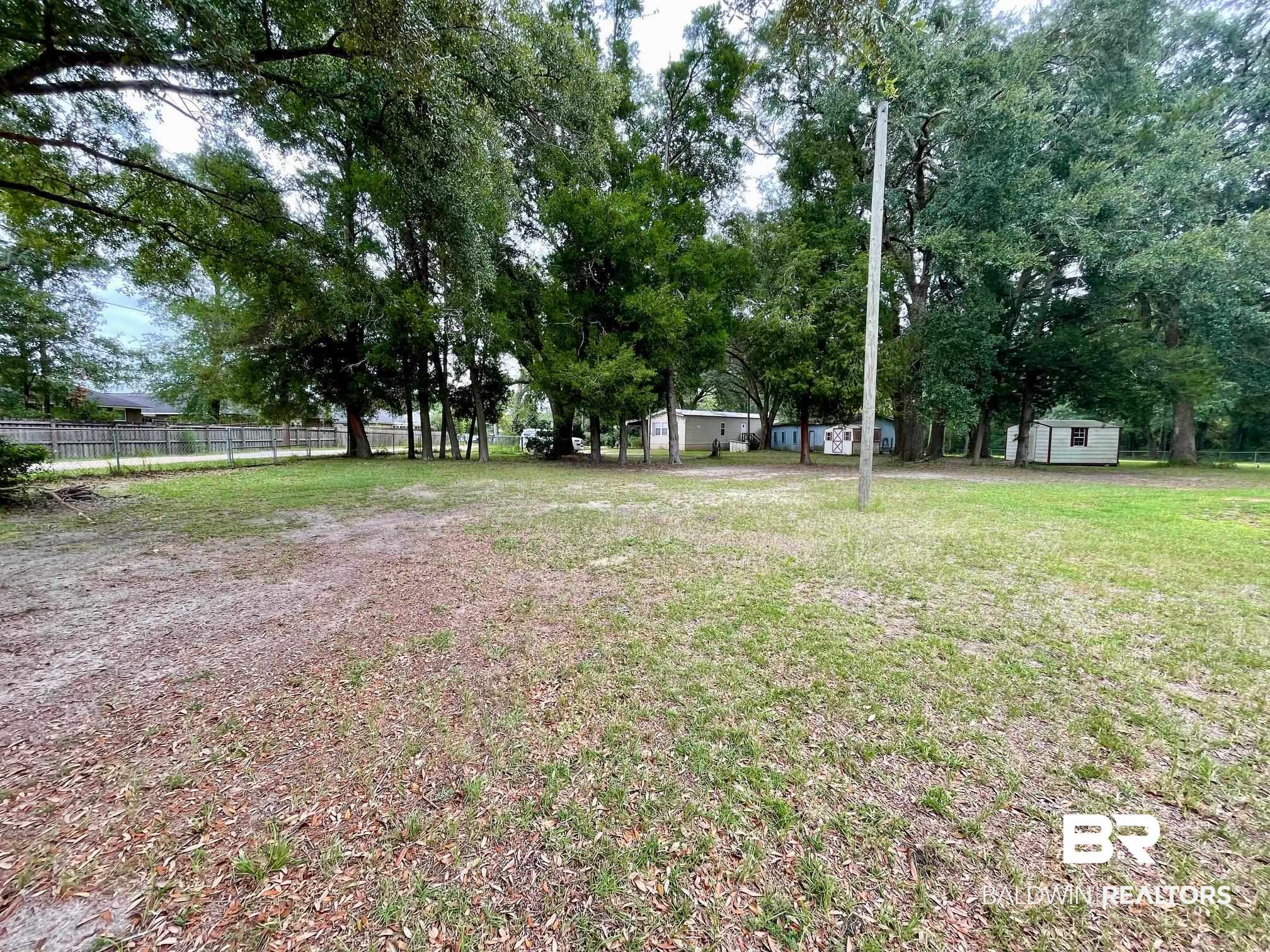 15338 Windbigler Drive Foley, AL 36535 - Photo 23 of 28 View of yard featuring a shed
