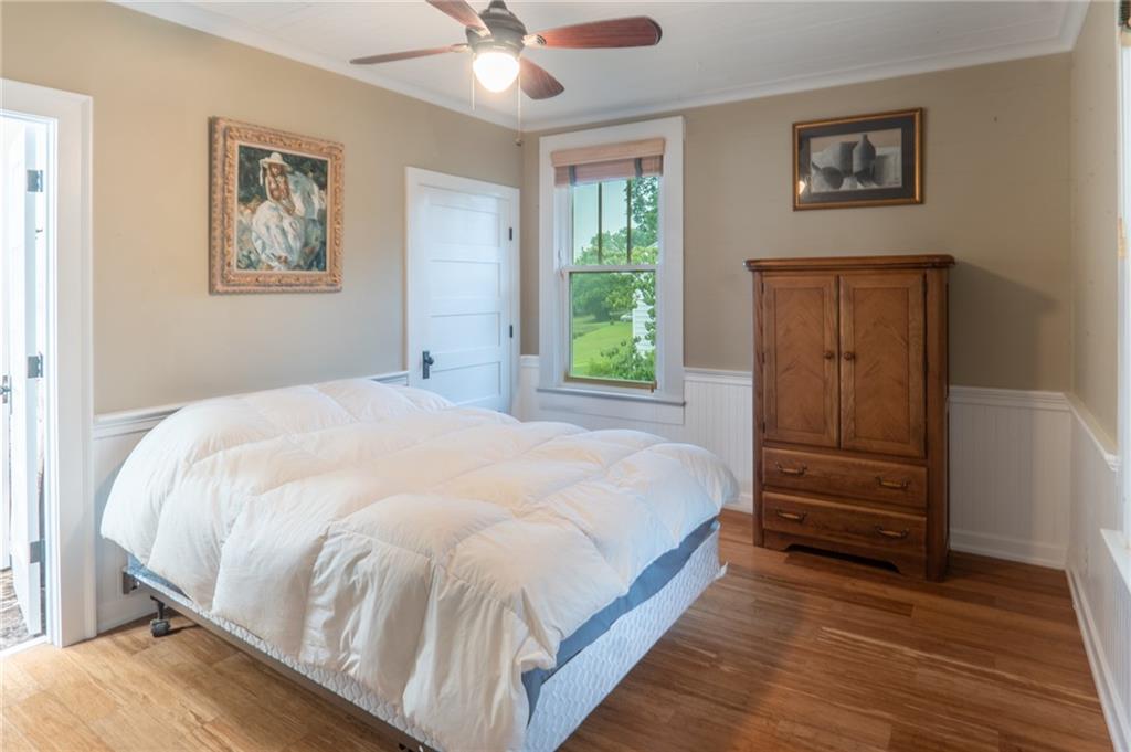 1815 Pickens Street Ball Ground, GA 30107 - Photo 17 of 38 a large bed sitting in a bedroom next to a window