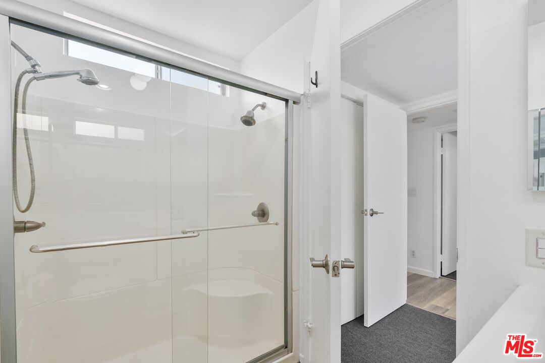 114 Fleet Street Marina del Rey, CA 90292 - Photo 20 of 26 a bathroom with a glass shower door