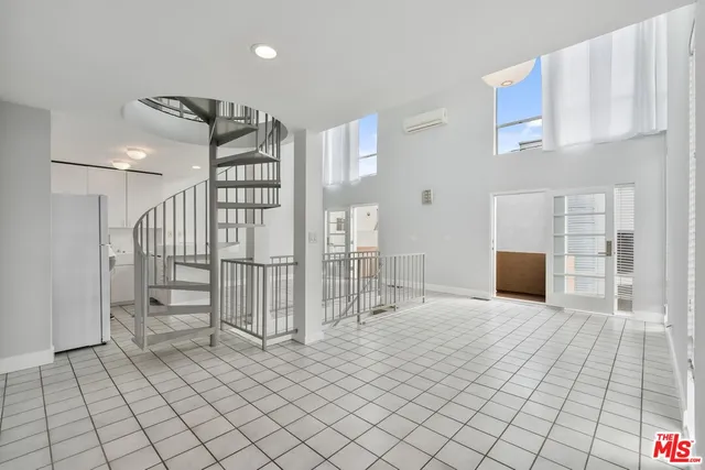 a view of a livingroom with stairs