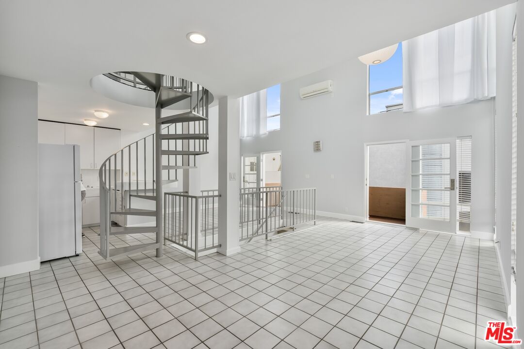 114 Fleet Street Marina del Rey, CA 90292 - Photo 3 of 26 a view of a livingroom with stairs