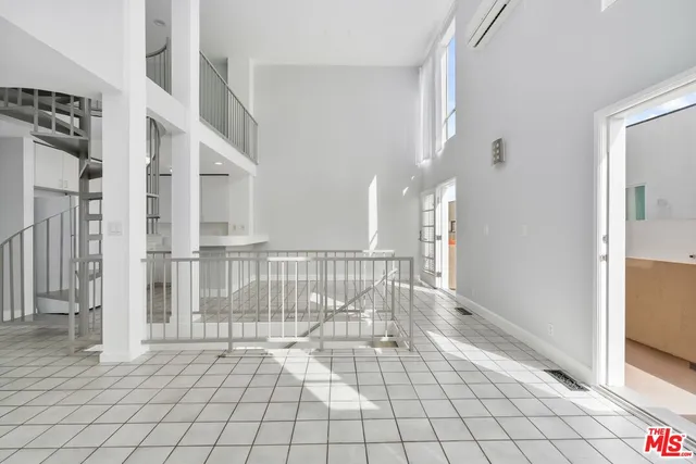 a view of kitchen and hall with wooden floor