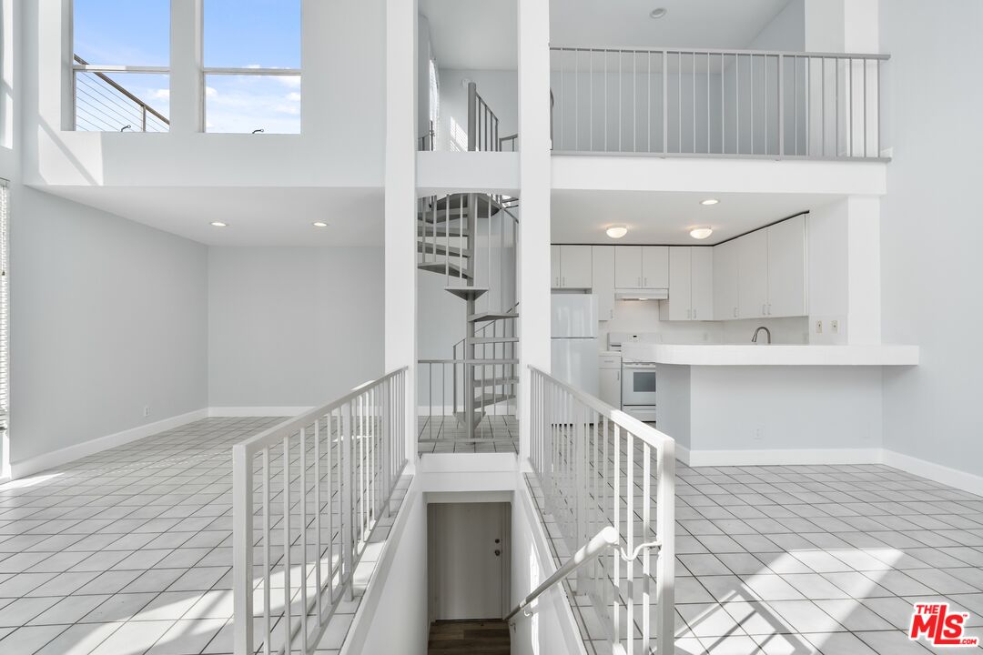 114 Fleet Street Marina del Rey, CA 90292 - Photo 6 of 26 a view of kitchen and hall with wooden floor