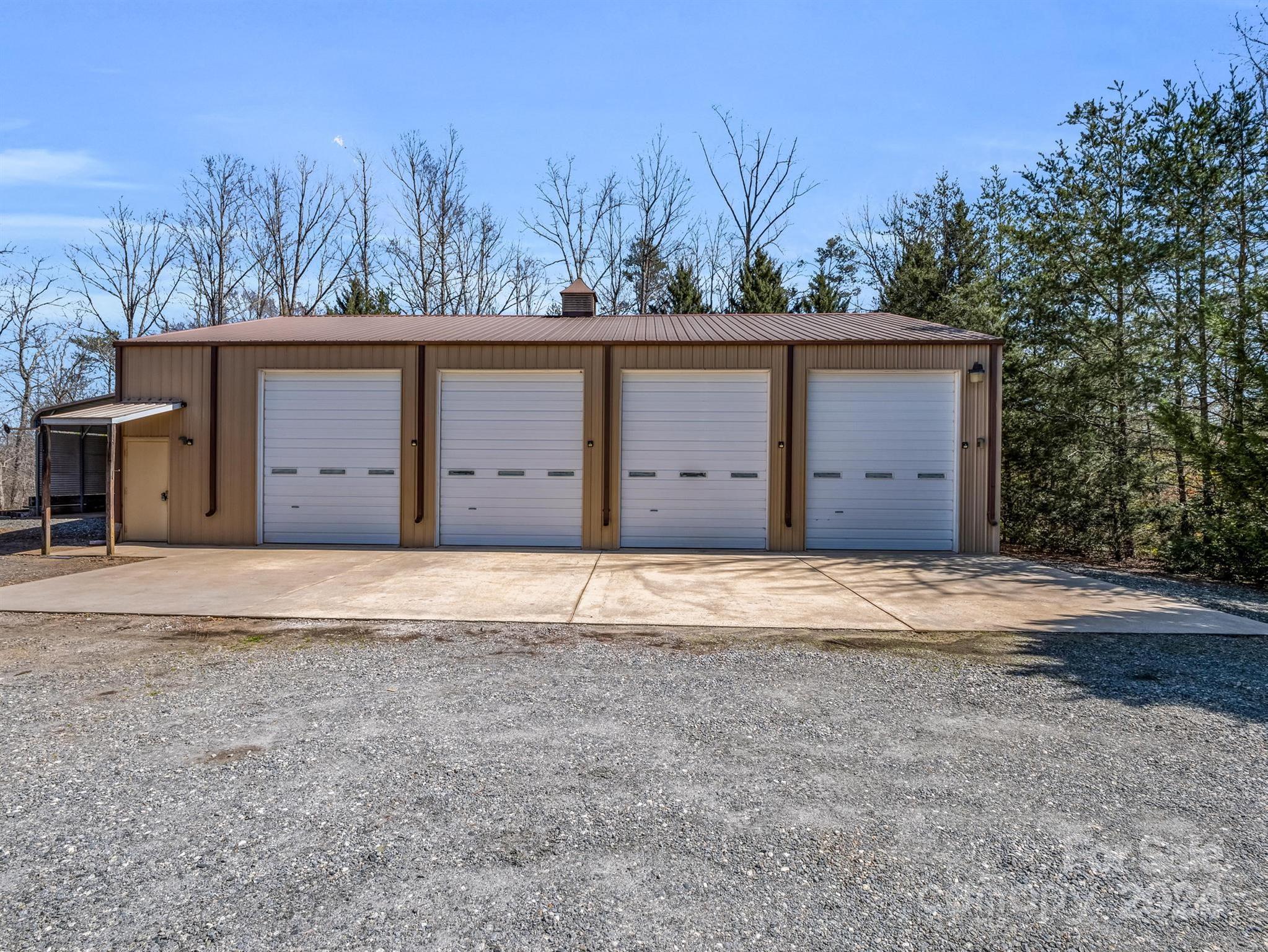 399 River Ridge Parkway Rutherfordton, NC 28139 - Photo 26 of 48 a wooden house with trees in the background