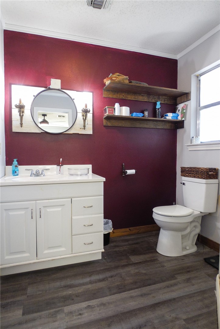 3010 North Interstate 37 Access Three Rivers, TX 78071 - Photo 25 of 29 a bathroom with a toilet a sink and mirror