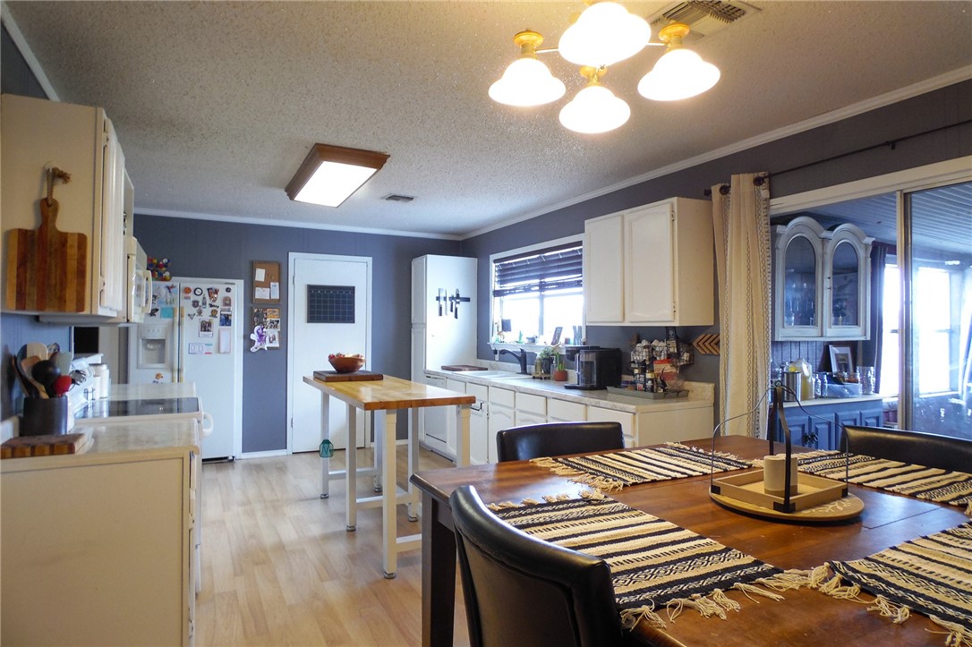 3010 North Interstate 37 Access Three Rivers, TX 78071 - Photo 26 of 29 a kitchen with a dining table and chairs