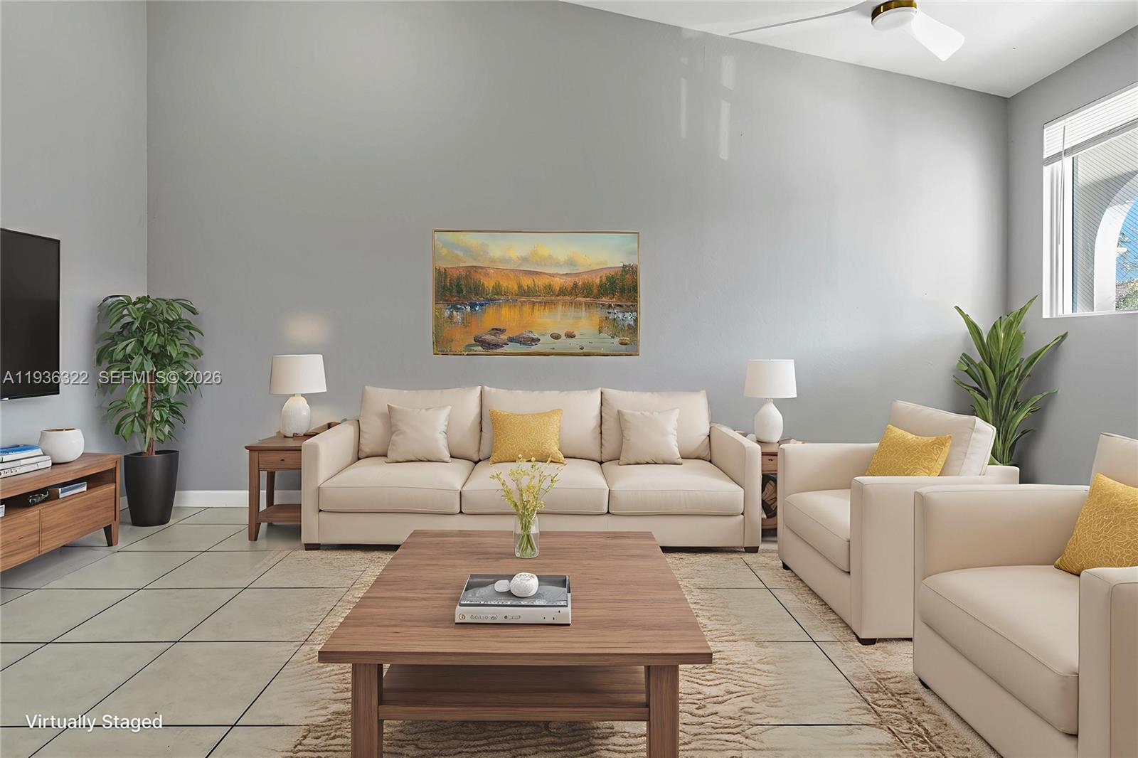 a living room with furniture potted plant and a window