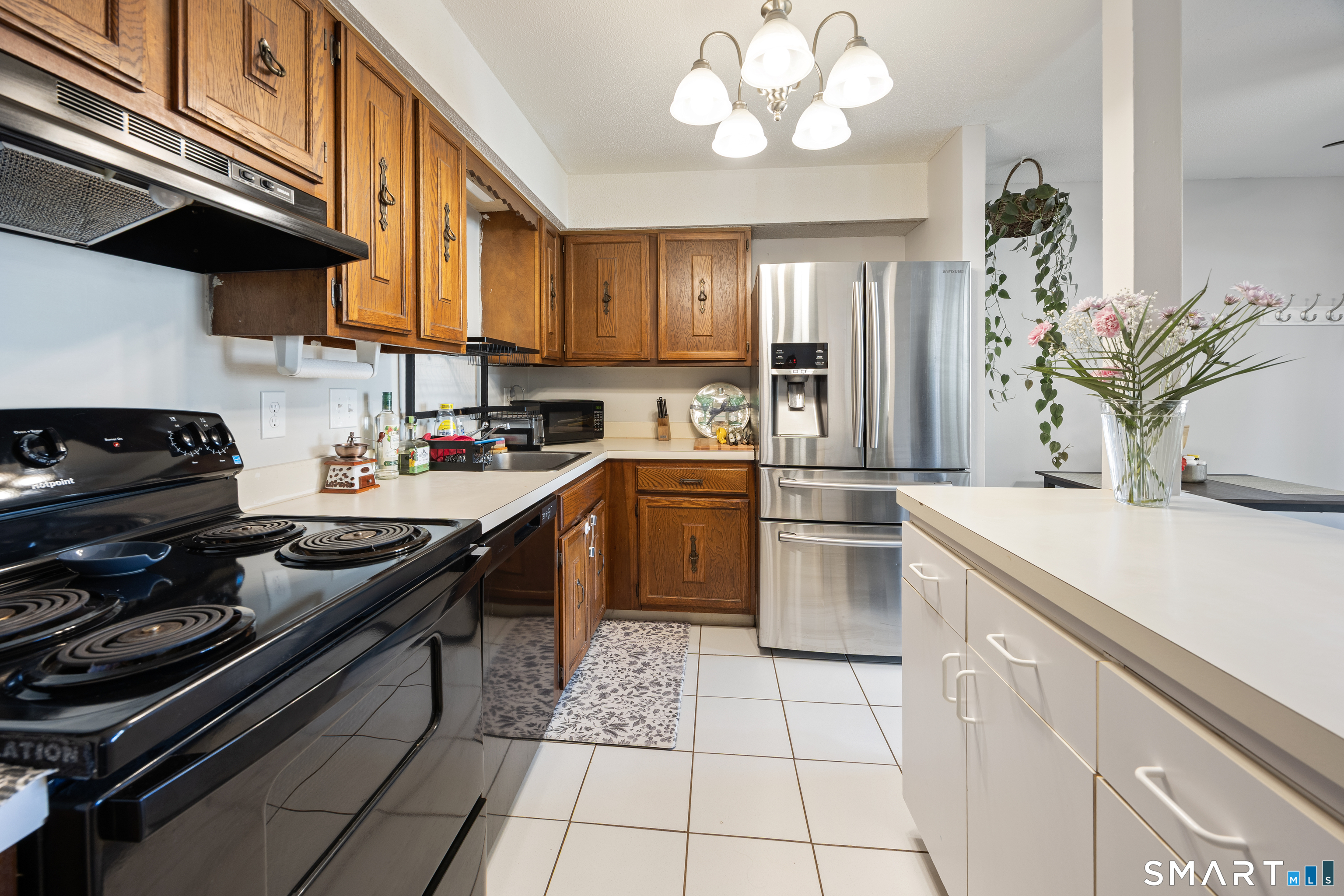560 Yale Avenue, Unit 82 Meriden, CT 06450 - Photo 6 of 22 a kitchen with a sink stainless steel appliances and cabinets