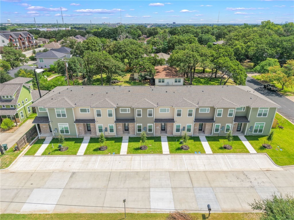 3213 Link Street, Unit 115 Bryan, TX 77801 - Photo 23 of 25 an aerial view of house with yard swimming pool and mountain view