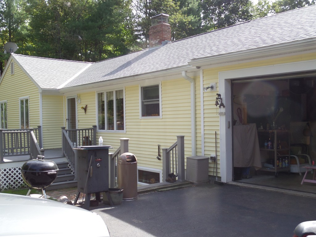 550 South Barre Road Barre, MA 01005 - Photo 2 of 26 a view of a patio with table and chairs and wooden fence