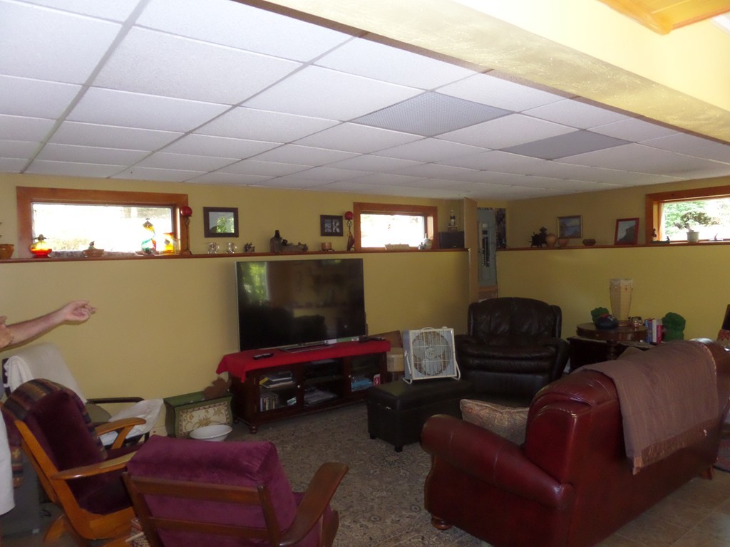 550 South Barre Road Barre, MA 01005 - Photo 25 of 26 a living room with furniture and a flat screen tv