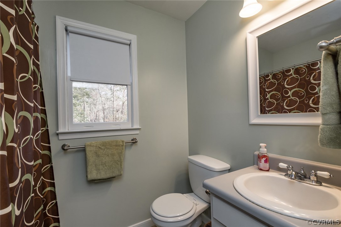 5009 Tulip Oak Road Chesterfield, VA 23832 - Photo 12 of 35 a bathroom with a toilet sink and mirror