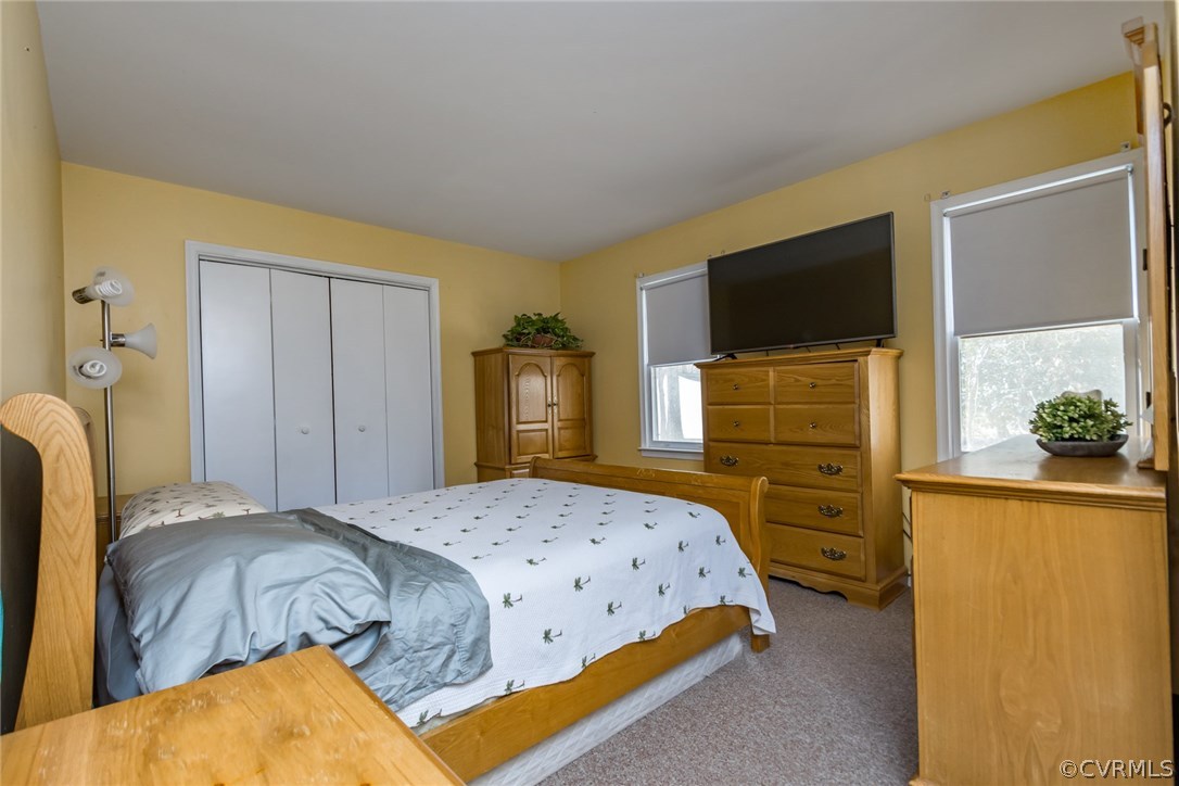 5009 Tulip Oak Road Chesterfield, VA 23832 - Photo 14 of 35 a bedroom with a bed and cabinets