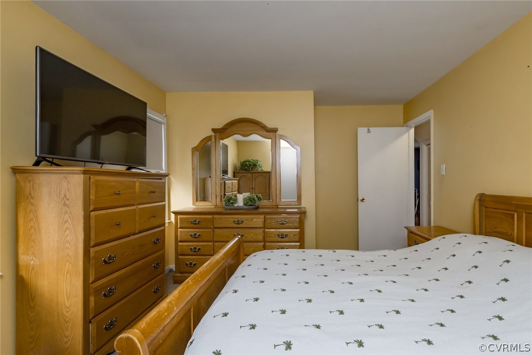 5009 Tulip Oak Road Chesterfield, VA 23832 - Photo 15 of 35 a bedroom with a bed and a flat screen tv
