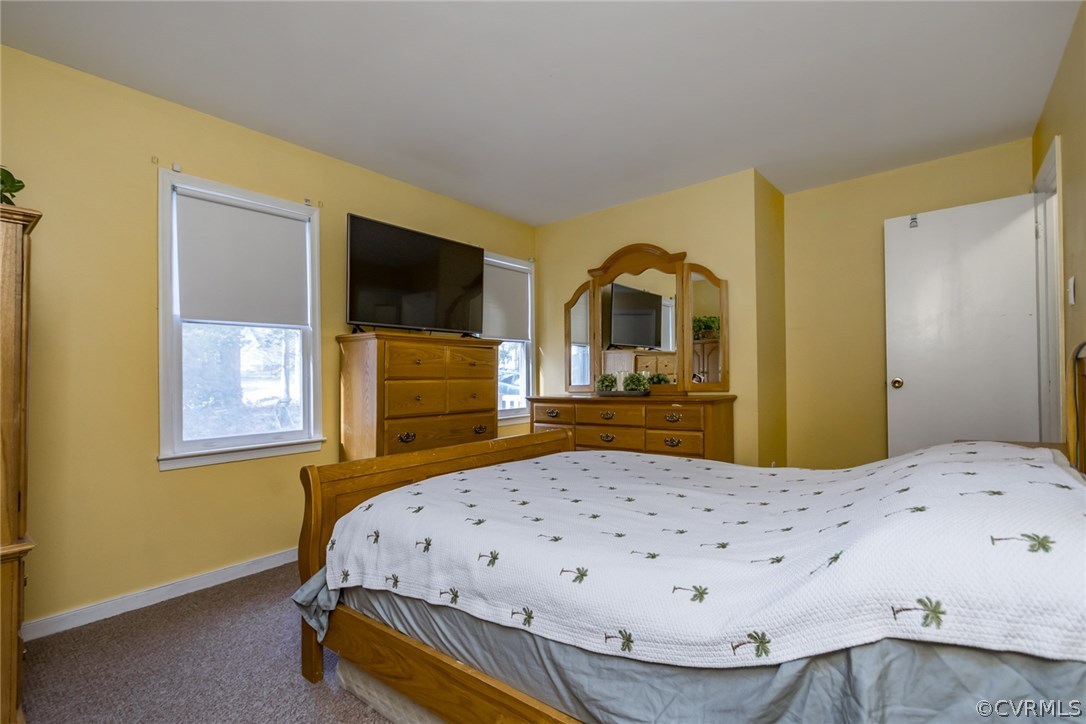 5009 Tulip Oak Road Chesterfield, VA 23832 - Photo 16 of 35 a bedroom with a bed and a flat screen tv