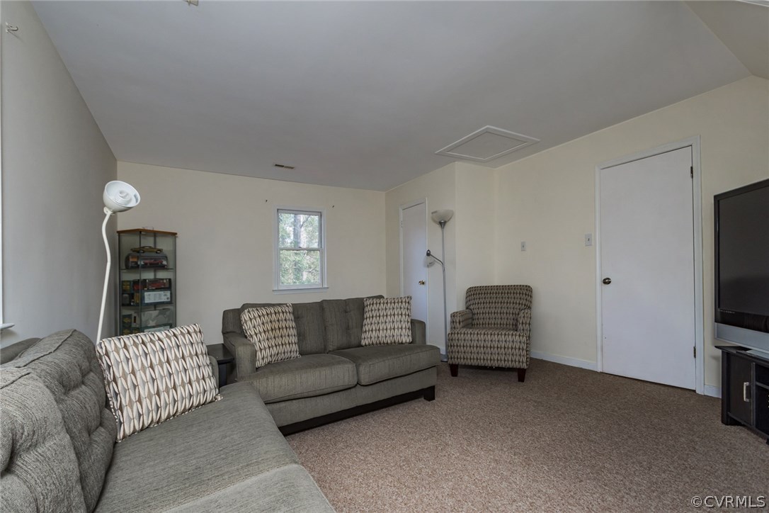 5009 Tulip Oak Road Chesterfield, VA 23832 - Photo 21 of 35 a living room with furniture and a flat screen tv